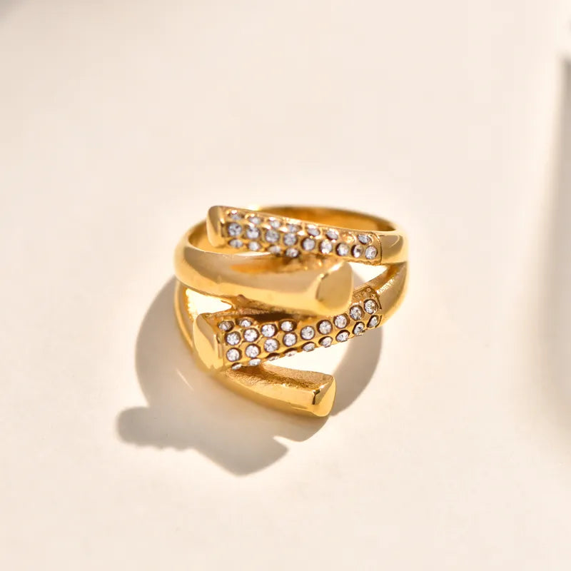 Double Layer Titanium Steel Gold Plated Ring With Large Embedded Diamonds And Butterfly Knot Irregular Geometry Crossed Square